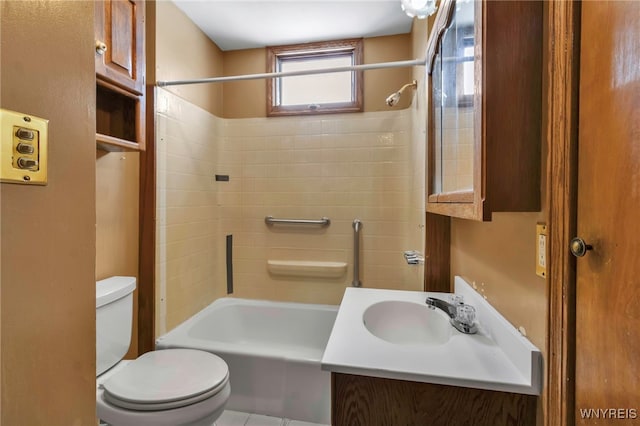 bathroom with bathtub / shower combination, vanity, and toilet