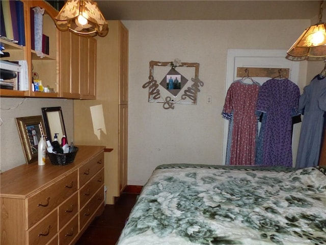 bedroom featuring dark wood-style floors