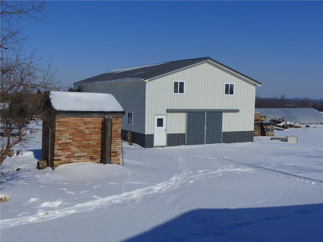 snow covered structure with an outdoor structure