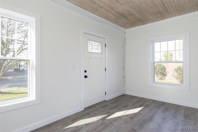 foyer with dark wood-style floors, wood ceiling, and baseboards