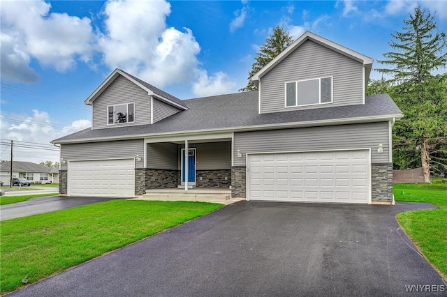 view of front facade with aphalt driveway, a front yard, stone siding, and an attached garage