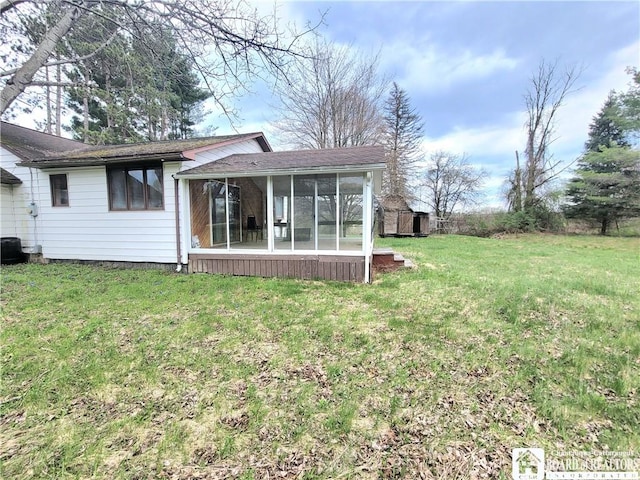 5185 Rte 474, Harmony, NY 14710 - back of property featuring a storage shed, a yard, an outdoor structure, and a sunroom