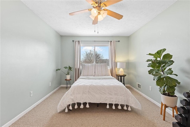 bedroom with light carpet, visible vents, and baseboards