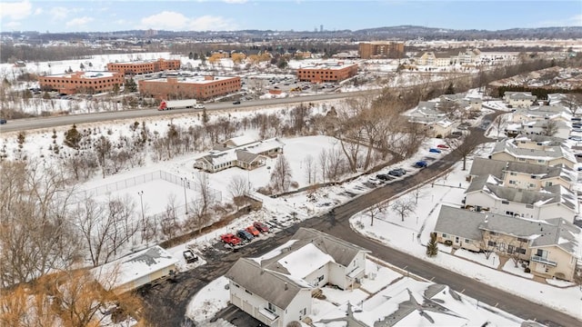 snowy aerial view featuring a residential view