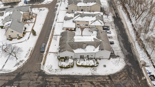 snowy aerial view featuring a residential view