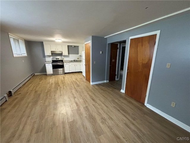 kitchen with white cabinets, a baseboard radiator, stainless steel electric stove, light countertops, and under cabinet range hood