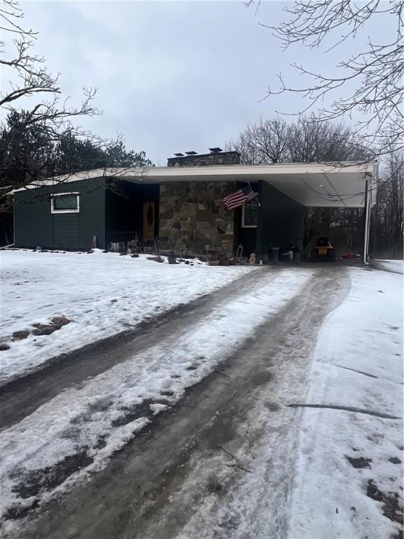 exterior space with an attached carport and driveway