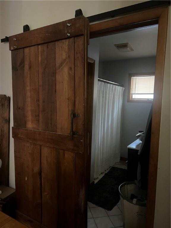 full bath with tile patterned floors, visible vents, and a shower with shower curtain