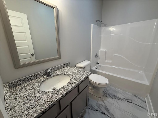 full bathroom featuring marble finish floor, bathing tub / shower combination, vanity, and toilet