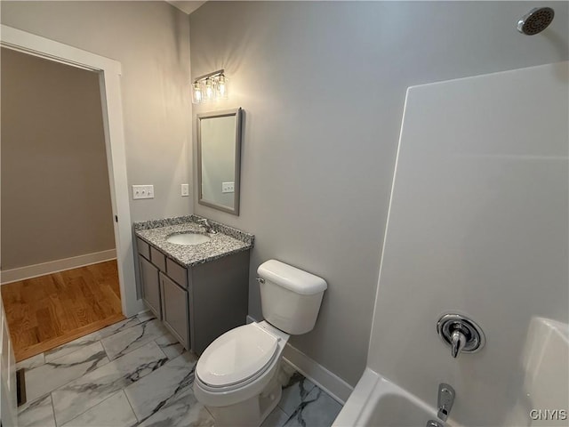 full bathroom with shower / bath combination, baseboards, toilet, marble finish floor, and vanity