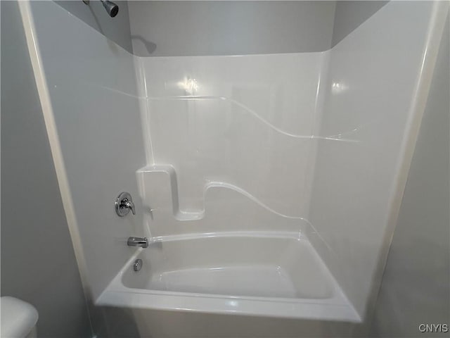 bathroom with toilet and shower / bathtub combination