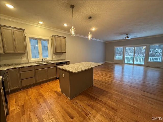 kitchen with light stone counters, pendant lighting, light wood finished floors, open floor plan, and a kitchen island