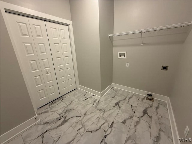 laundry room featuring marble finish floor, laundry area, hookup for a washing machine, and hookup for an electric dryer