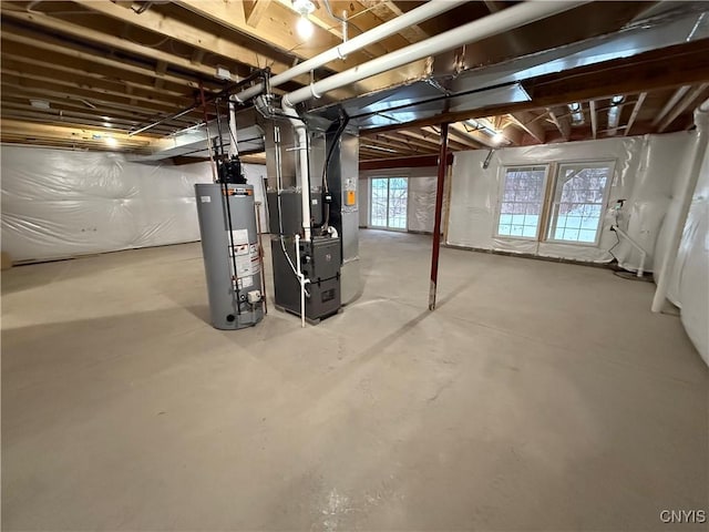 basement featuring water heater and heating unit