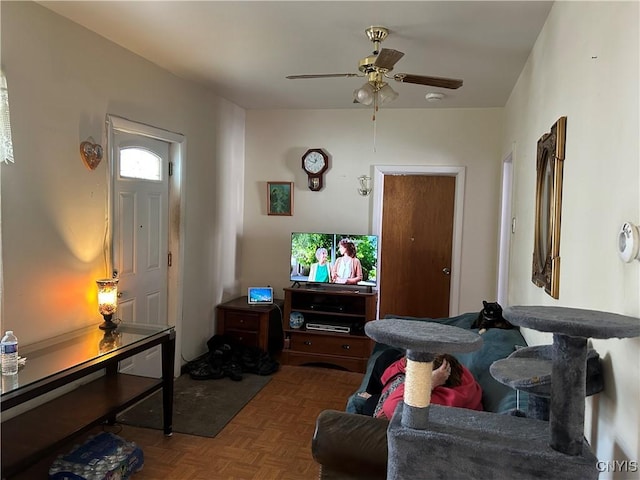 living room with a ceiling fan