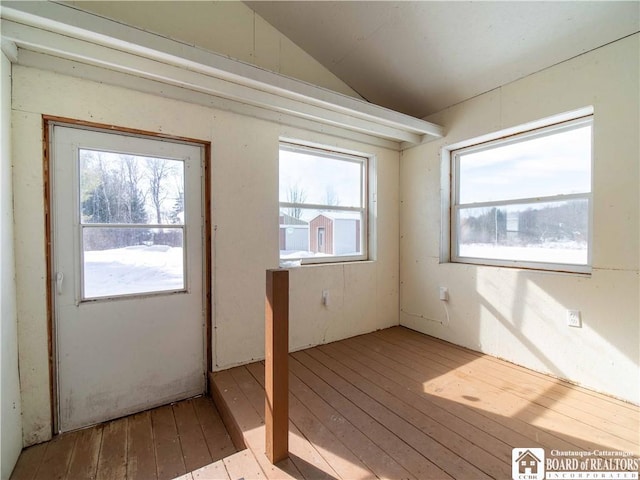 interior space with vaulted ceiling and light wood-type flooring