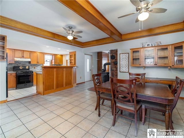 dining room featuring beam ceiling, ceiling fan, baseboards, and light tile patterned floors