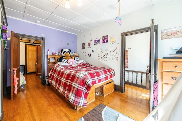 bedroom featuring wood finished floors