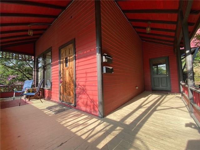 wooden terrace with a porch