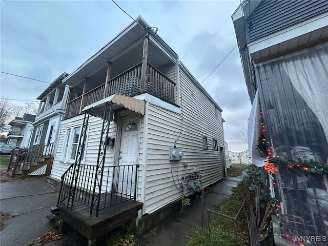 view of property exterior featuring a balcony