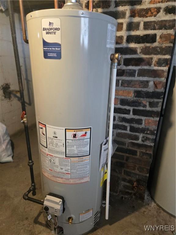 utility room with water heater