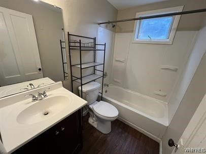 bathroom featuring shower / bath combination, toilet, wood finished floors, and vanity