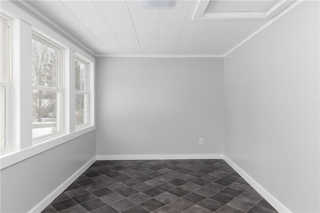 unfurnished room featuring ornamental molding and baseboards