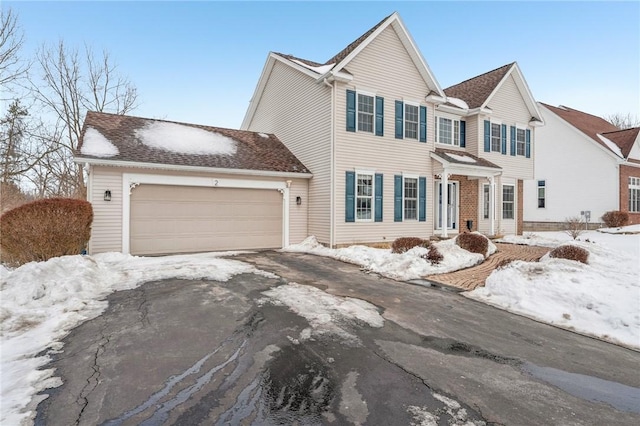 view of front facade featuring driveway and an attached garage