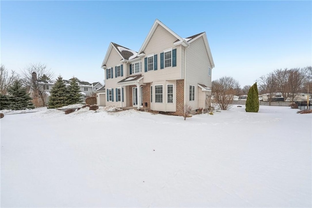 view of front of home featuring brick siding