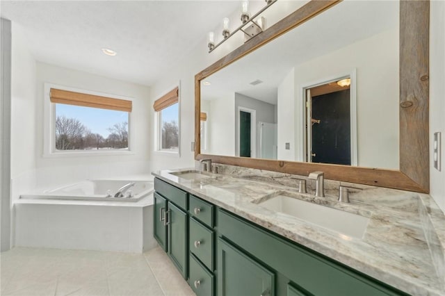 full bath featuring double vanity, tile patterned flooring, a sink, and a bath