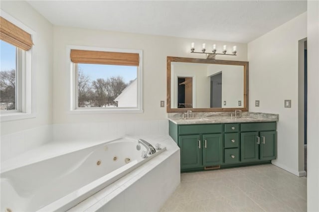 full bath featuring tile patterned flooring, a sink, a whirlpool tub, and double vanity