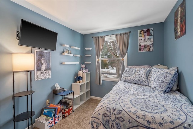 bedroom with carpet floors and baseboards