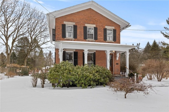 view of front of home featuring brick siding