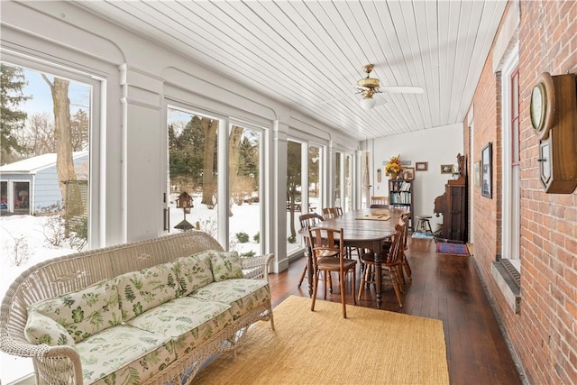 sunroom / solarium with ceiling fan and wooden ceiling