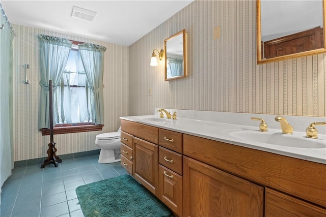 full bathroom with tile patterned flooring, a sink, toilet, and wallpapered walls