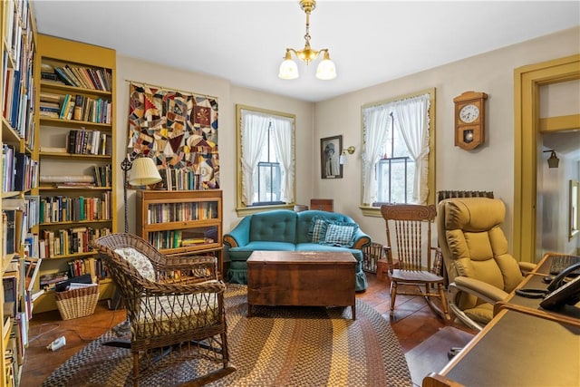 sitting room with plenty of natural light and a notable chandelier