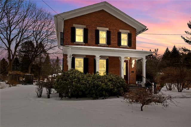 view of front of house featuring brick siding