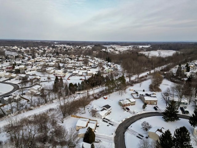 snowy aerial view with a residential view