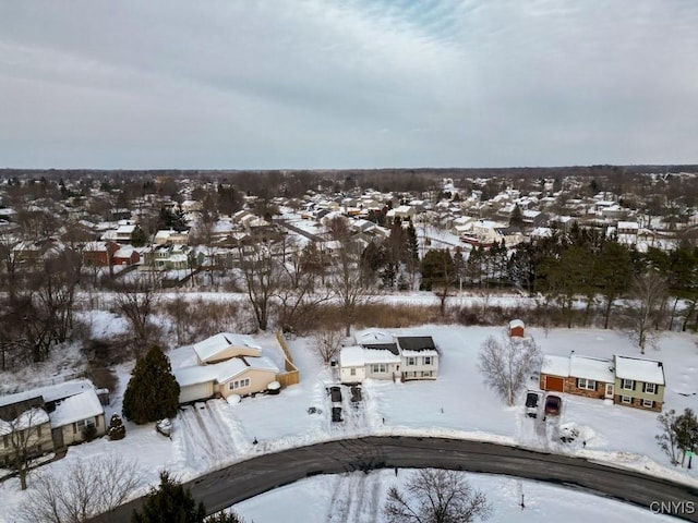 snowy aerial view featuring a residential view