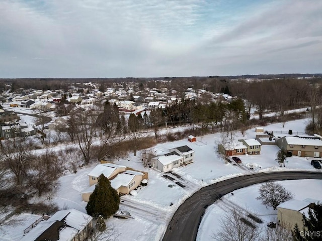 snowy aerial view featuring a residential view