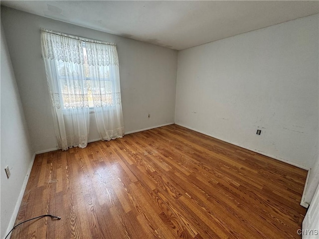 unfurnished room featuring wood finished floors