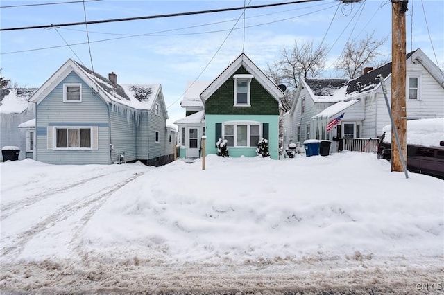 view of snow covered house