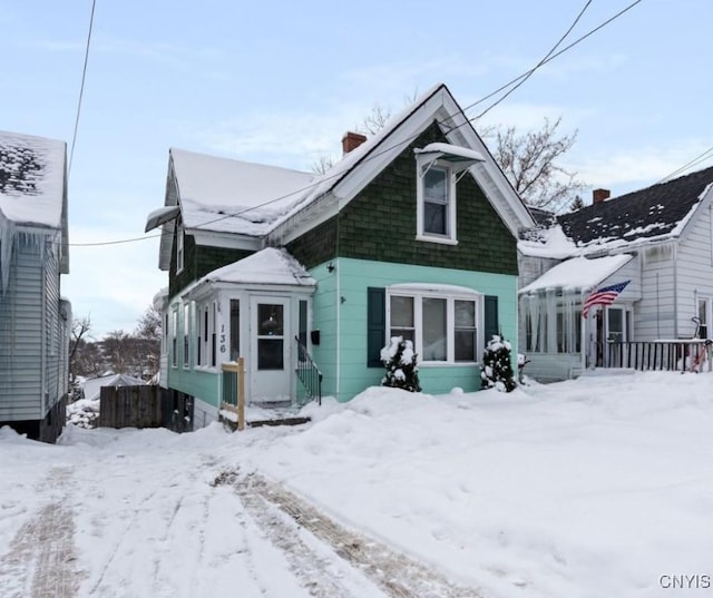 bungalow-style house featuring a chimney