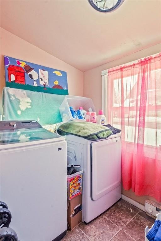 laundry room featuring laundry area and washer and clothes dryer