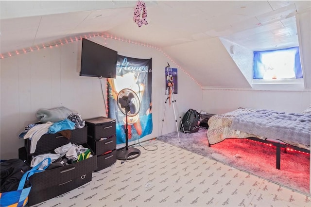 bedroom featuring lofted ceiling and light colored carpet