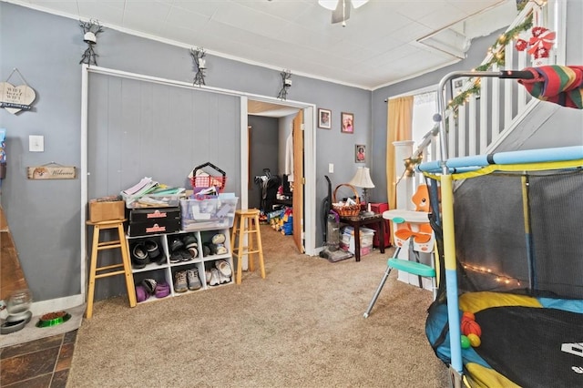 carpeted bedroom with ornamental molding