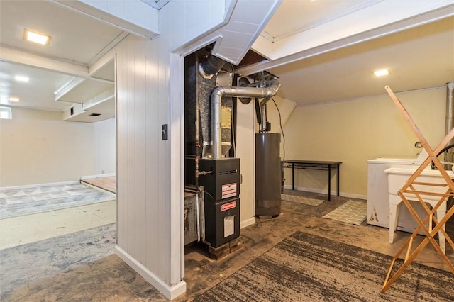 utility room featuring washing machine and dryer and water heater