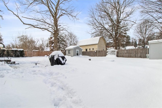 yard layered in snow with fence