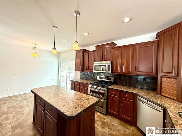 kitchen with recessed lighting, decorative backsplash, appliances with stainless steel finishes, decorative light fixtures, and a center island