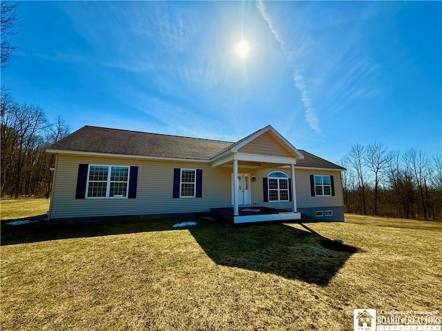 single story home featuring a front yard